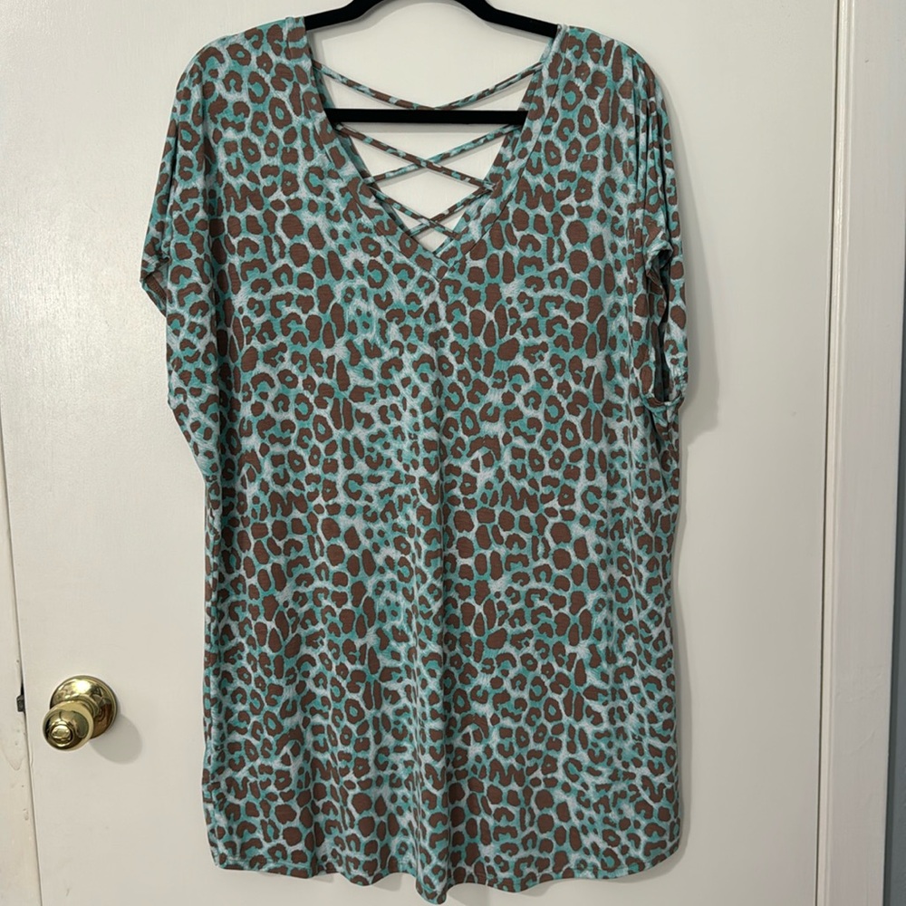 Now N Forever teal and brown cheetah top with cross cross detail on the back